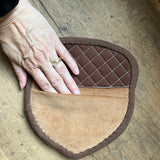 An in the hoop design of an acorn shaped potholder by snugglepuppyapplique.com