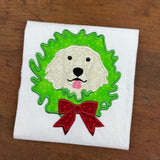 An appliqué of a English Setter dog with its head through a Christmas wreath in 6 sizes by Snugglepuppyapplique.com