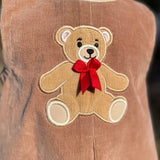 An applique of an old fashioned teddy bear by snugglepuppyapplique.com