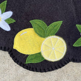 Close up of lemons on a felt ITH candle mat made with an embroidery design by snugglepuppyapplique.com