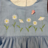 An embroidery design of 6 daisies and a butterfly by snugglepuppqapplique.com