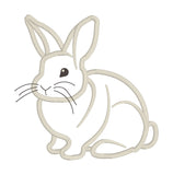 an applique deign of a sitting rabbit with whiskers by snugglepuppyapplique.com