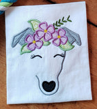 An appliuqe of an abstract Greyhound's face wearing a crown of flowers and leaves by snugglepuppyapplique.com