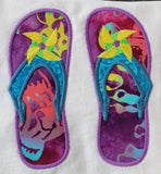 An applique of Flip flops with embroidered pinwheels as decoration by snugglepuppyapplique.com