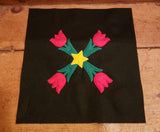An applique of 4 tulips around a center five pointed star Pennsylvania Dutch Primitive Zigzag design by Snugglepuppyappliue.com