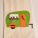 an applique of a camper with cacti in the window box and a chilli pepper on the door and a mustache on the fender by snugglepuppyapplique.com