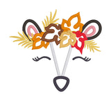 An applique of a skunks face with a autumn leaf crown by snugglpuppyapplique.com