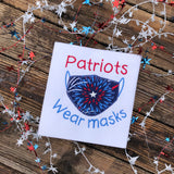 An applique of a face mask with the words "Patriots wear masks" by snugglepuppyapplique.com