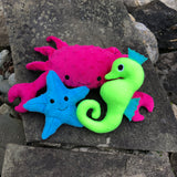 Set of 3 sea creatures stuffies, crap, starfish and seahorse made in the hoop with an embroidery machine by snugglepuppyapplique.com