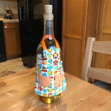 In the hoop wine bottle apron by snugglepuppyappilque.com