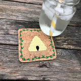 An in the hoop summer coaster of a bee hive with an ivy boarder by snugglepuppyapplique.com