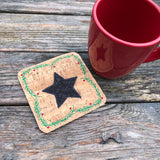 An in the hoop coaster embroidery design with a star in the center and evergreen sprigs and berries boarder by snugglepuppyapplique.com
