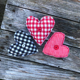 In the hoop primitive raw edge heart stuffy with button tufted front and pocket on the back embroidery design by snugglepuppyapplique.com