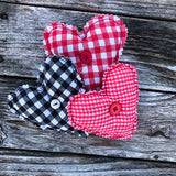 In the hoop primitive raw edge heart stuffy with button tufted front and pocket on the back embroidery design by snugglepuppyapplique.com