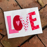 A zigzag applique of letters LOVE  by snugglepuppyapplique.com