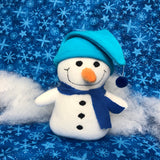In the hoop stuffed snowman doll with stuffed carrot nose, hat and scarf by snugglepuppyapplique.com