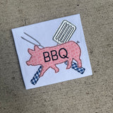 A bean stitch applique of BBQ utensils and a Pig with "BBQ" embroidered on it. by snugglepuppyapplique.com