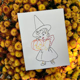 A Vintage bean stitch little girl dressed as a witch and holding a jack-o-lantern embroidery design