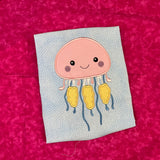 An applique of a babyish looking Jellyfish by snugglepuppyapplique.com