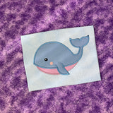 An applique of a babyish whale by snugglepuppyapplique.com