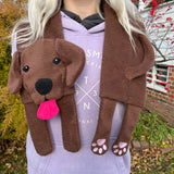 An in the hoop embroidery design of a Labrador retriever made into a scarf by snugglepuppyappliqye.com Head at one end with tongue out.