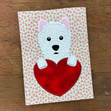A Valentine Applique of a West Highland Terrier with its paws on a heart shape by snugglepuppyapplique.com