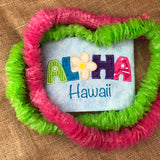 An applique of a flower and the letters A-L- H-A to make the word "Aloha" and the word "Hawaii" embroidered underneath by snugglepuppyapplique.com