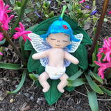 ITH Baby Bluebell Fairy Embroidery design, baby, freestanding lace butterfly wings, flower hat with embroidered ladybug, diaper, leaf bed, snugglepuppyapplique.com