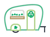 An applique of a camper with clover in window box for St. Patricks day by snugglepuppyapplique.com