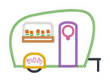 An applique of a camper with the female symbol on the door, "mom" on the fender and flowers in a window box by snugglepuppyapplique.com
