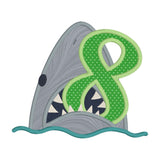 An applique of a shark biting the number eight by snugglepuppyapplique.com