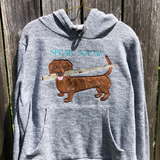 dachshund with a stick in this mouth appliqué embroidery design, snugglepuppyapplique.com