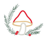 An applique of a mushroom with embroidered evergreen branches and berries by snugglepuppyapplique.com