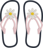 An applique of flip-flops with a daisy embroidered on them. by snugglepuppyapplique.com