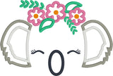 an applique design of a koala's ears, nose and closed eyes with lashes wearing a crown of flowers and leaves by snugglepuppyapplique.com