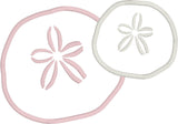 An appliqué of two sand dollars by snugglepuppyapplique.com