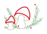 An applique of two mushrooms with embroidered evergreen springs and berries by snugglepuppyapplique.com