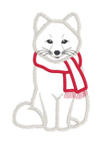 An applique design of an arctic fox wearing a scarf by snugglepuppyappliuqe.com