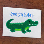 An applique of an Alligator with words "see you later" by snugglepuppyapplique.com
