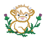 An applique design of a highland cow lying in thistles