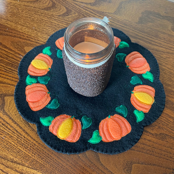 An in the hoop scalloped  felt candle mat with pumpkins and leaves by snugglepuppyapplique.com An embroidery design
