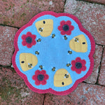 an in the hoop candle mat with bees, beehives and flowers by snugglepuppyapplique.com