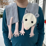 An in the hoop embroidery design of an Opossum scarf with tail. by snugglepuppyapplique.com