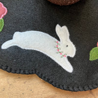 Close up of a bunny on an in the hoop candle mat by snugglepuppyapplique.com