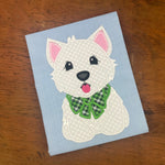 An applique embroidery design of a west highland terrier sitting and wearing a bow around its neck in 6 sizes by snugglepuppyapplique.com