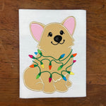 An applique of a welch corgi wrapped in christmas lights by snugglepuppyapplique.com