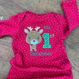 An applique of a cute reindeer and the number one with the words "my 1st Christmas" embroidered  by snugglepuppyapplique.com