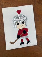 An applique of a hockey playing wearing the helmet of a Trojan, Spartan or Knight by snugglepuppyapplique.com