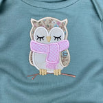An applique of a sleepy owl wearing a scarf by snugglepuppyapplique.com