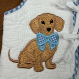 An applique of a dachshund wearing a large bow around his neck by snugglepuppyapplique.com